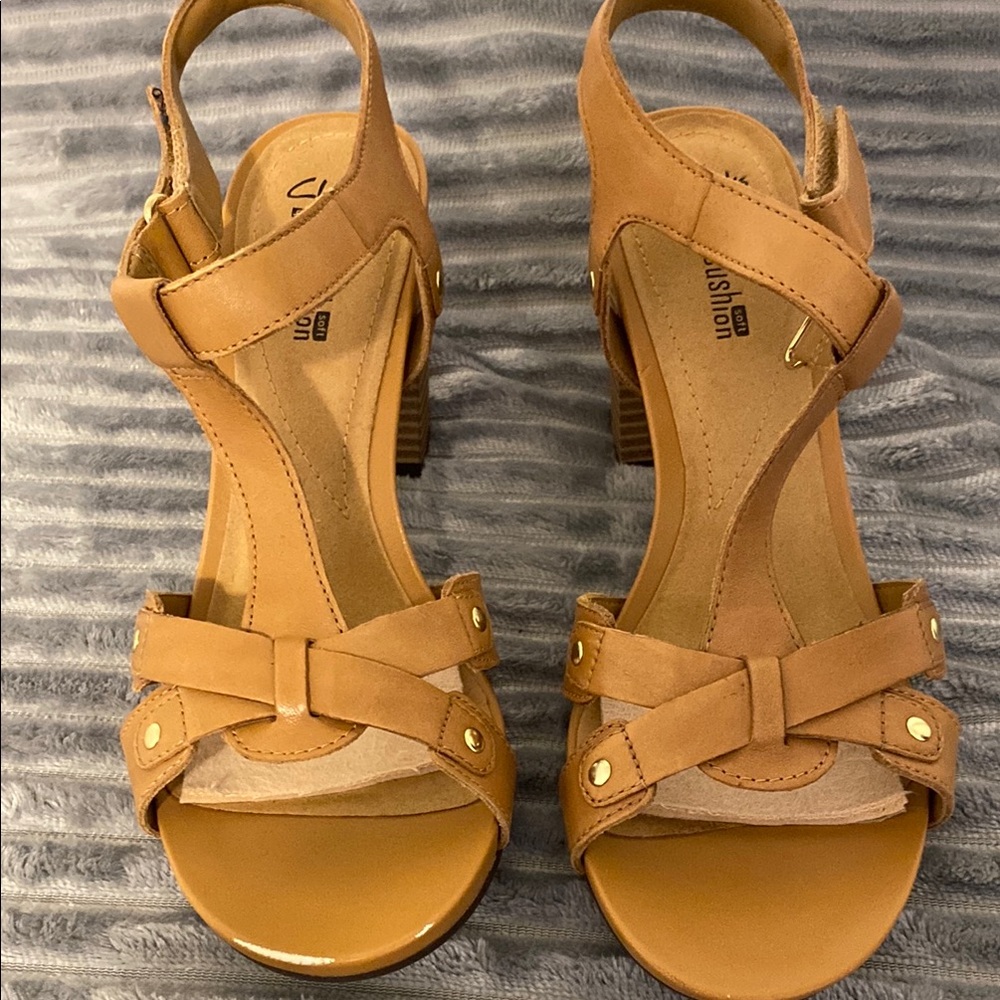 Clarks Stylish Tan Sandals, in good condition. Does have an area on right toe.